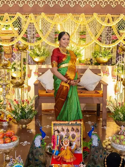 We honor timeless traditions with a touch of rustic elegance. This Seemantham (baby shower) setup features intricate floral arrangements, brass lamps, and peacock details to create a blessed and beautiful celebration.