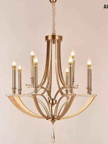 A modern luminary with a classic soul. This candle-style chandelier in a gold finish is designed with graceful curves, providing both beautiful form and functional light for a timeless interior.