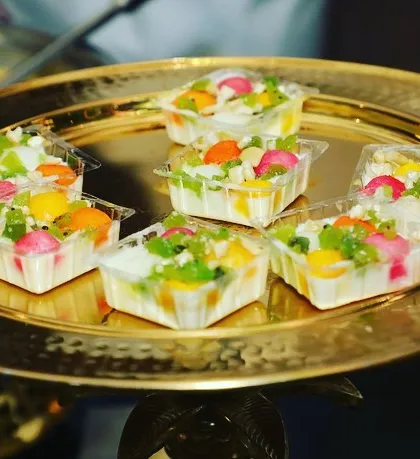 A platter of our fusion Bengali sweets. These colorful, bite-sized treats combine traditional flavors with modern presentation, making the wedding buffet look versatile and lip-smacking.