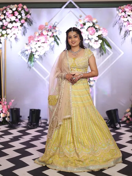 This client looks radiant in the full pastel yellow lehenga set. It’s a perfect example of how renting allows you to wear a beautifully coordinated designer outfit for any special occasion.