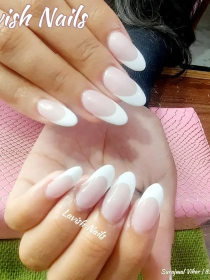 Another example of a beautiful, classic French manicure on almond-shaped nails.