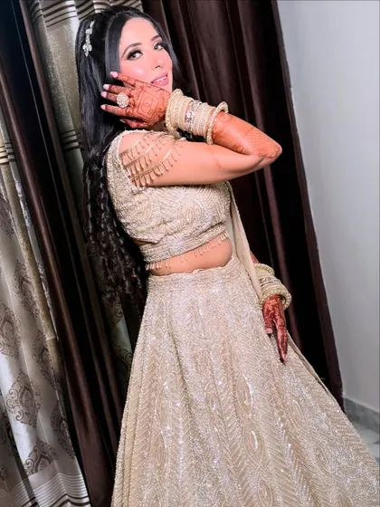 A playful and happy bride-to-be. Her engagement makeup is fresh and radiant, paired with a stylish half-up hairstyle.