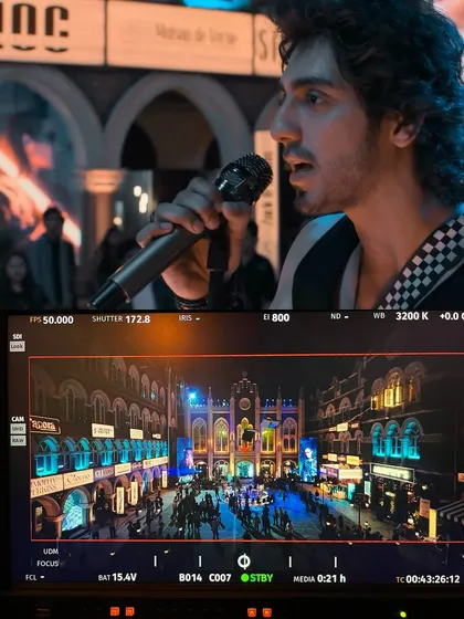 Another monitor view from the 'Saiyaara' shoot, showing a close-up of the actor against the colorful, bokeh-filled background created by our lighting.