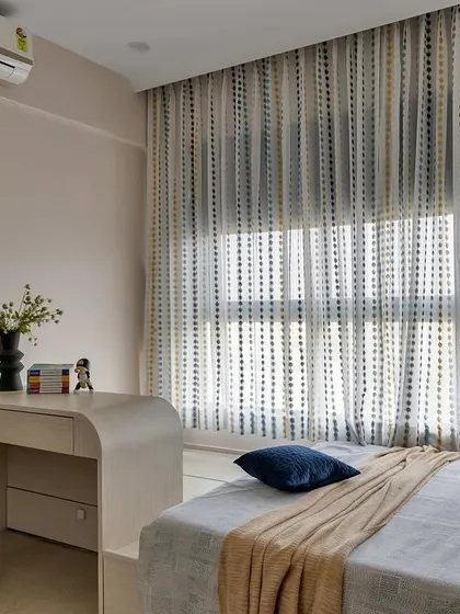 A cozy and modern retreat for a child, this room perfectly blends relaxation and productivity. It features a comfortable bed, a sleek study desk with an ergonomic chair, and soft, natural lighting from the large window.