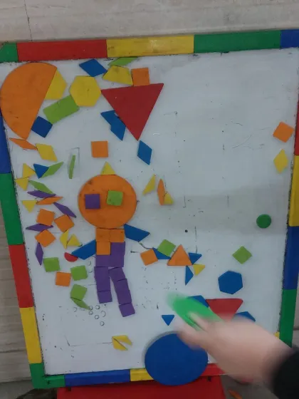 A finished magnetic shape creation on the whiteboard. This kind of open-ended art allows children to express their unique vision and build whatever they can imagine.