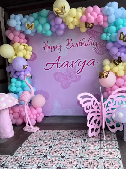 We transform spaces to match your vision. This enchanting butterfly-themed birthday setup, complete with a custom backdrop and balloon arch, shows how we bring your chosen party theme to life with beautiful decor.