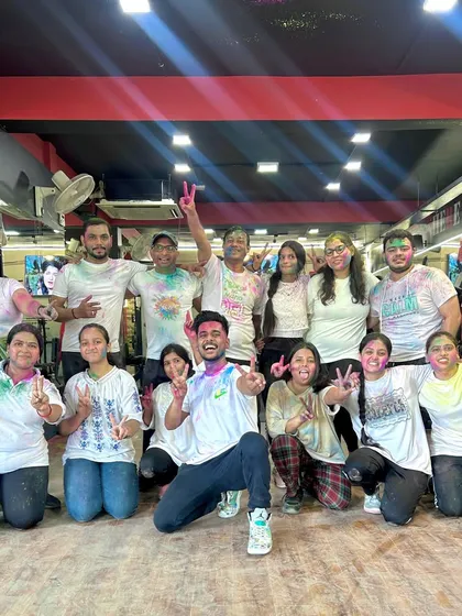 A happy, colorful group shot after our Holi Zumba party. These smiles say it all. We believe in celebrating every moment together.
