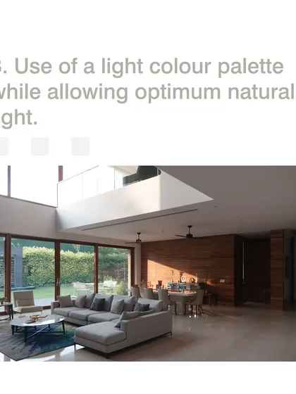 We use a light color palette and maximize natural light to create the illusion of a larger, more open space. This double-height living room feels expansive and airy, connecting directly to the garden outside.