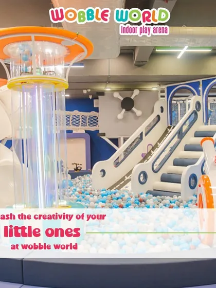 Our space-themed play structure is designed to unleash creativity. This wide shot shows how different elements connect to create an imaginative world.