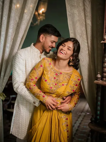 The most beautiful moments are often the unscripted ones. I focus on capturing genuine laughter and connection, like this candid moment during an ethnic-themed pre-wedding shoot, making you feel comfortable and completely yourselves.