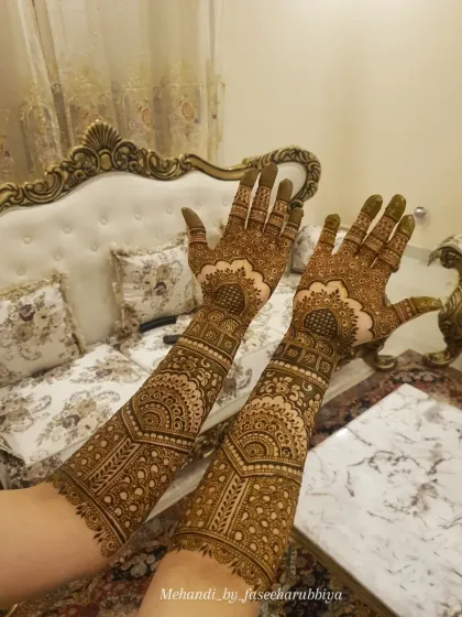 A beautiful example of a non-bridal full coverage design, with architectural and mandala elements.