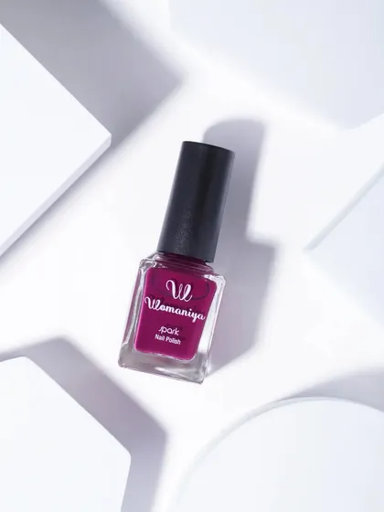A minimalist and clean product shot for a nail polish brand. I used simple white geometric blocks and controlled shadows to draw all the attention to the product's color and branding.