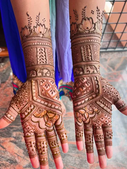 A full view of the engagement mehendi, showcasing the beautiful lotus and elephant motifs.