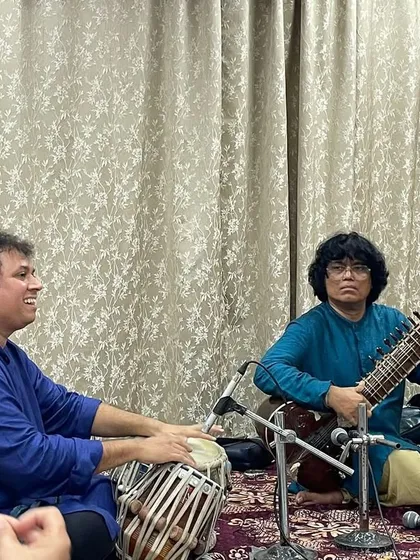 A moment of musical conversation during an intimate recital. Here, I am performing with Satyajit Talwalkar on tabla, exploring the nuances of the raag for an appreciative audience.