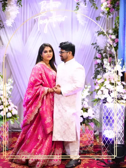 This lovely couple chose a classic white textured sherwani for him and a vibrant pink Banarasi lehenga for her. It's a beautiful blend of elegance and tradition.