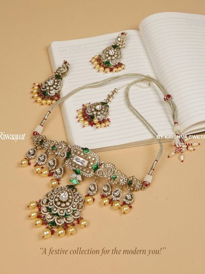 Tradition meets today in this festive Kundan collection for the modern you. This beautiful choker set, with its intricate details and colorful stones, is for the woman who writes her own story.