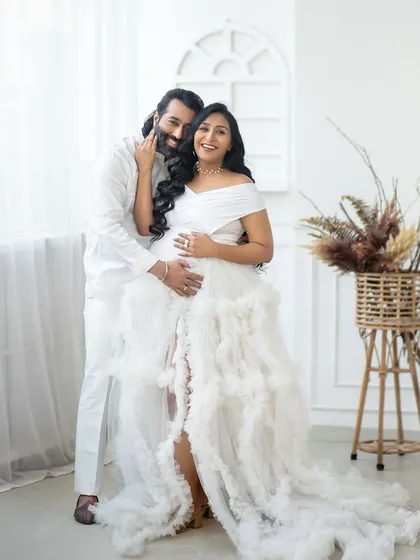 My studio can be transformed into a serene, heavenly space for your maternity shoot. This all-white theme with a beautiful ruffled gown creates a timeless and angelic portrait of motherhood.