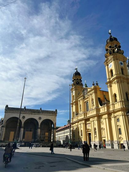 The Old Town of Marienplatz, Munich, on a beautiful sunny day. A classic travel shot that captures the stunning architecture and lively atmosphere of the town square.