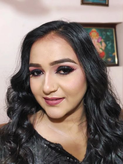 A portrait showing the soft smokey eye and wavy hair, a perfect combination for a night out.