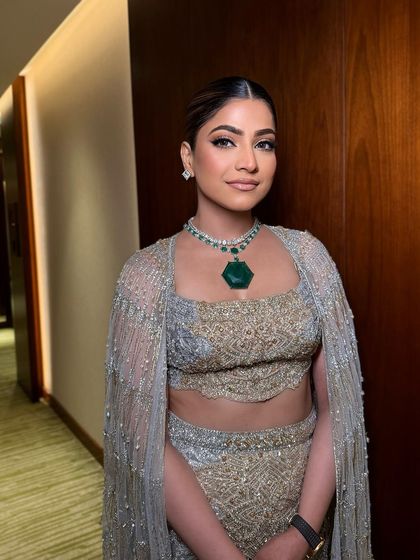 A beautiful, elegant look for a special evening event. The makeup is clean and classic, with a focus on flawless skin.