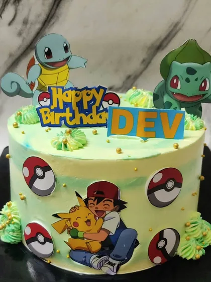 Gotta catch 'em all! This Pokémon cake for Dev's birthday was so much fun to create. It features Ash, Pikachu, Squirtle, and Bulbasaur on a yummy vanilla cake, ready for a Pokémon battle.