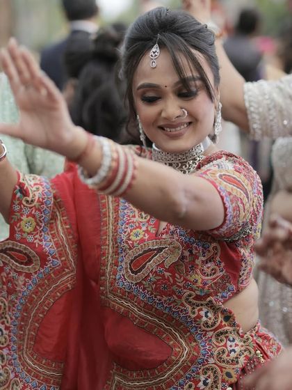 Dancing the night away. Her makeup is still flawless, allowing her to fully immerse herself in the celebration.