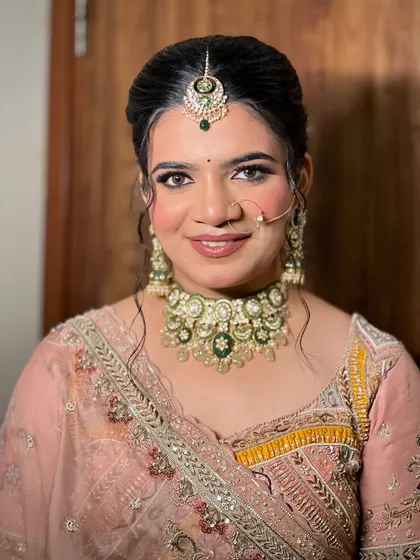 A final portrait shot, capturing the bride's confidence and the flawlessness of her complete bridal styling.