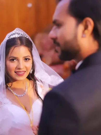 A close-up of the Christian bride looking at her groom. Her makeup is subtle yet defining, with a focus on glowing skin and soft eyes.