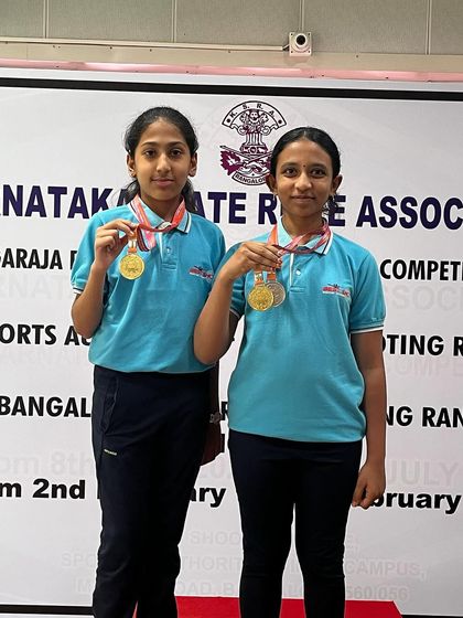 Sarvadhi and Charvi with their Gold and Silver medals from the 10M Air Pistol women's event at the Nagaraj Rao Shooting Championship.