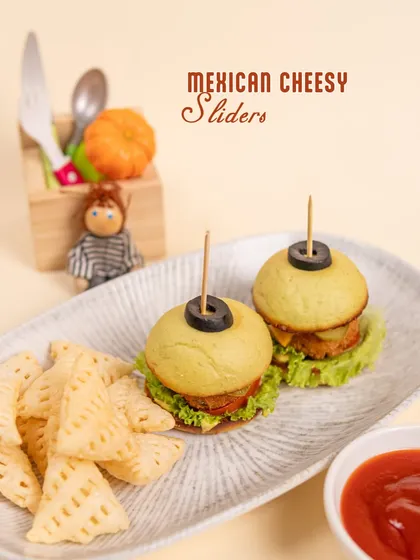 How cute are these Mexican Cheesy Sliders? They are packed with flavor and perfectly sized for little hands, making them a party favorite.