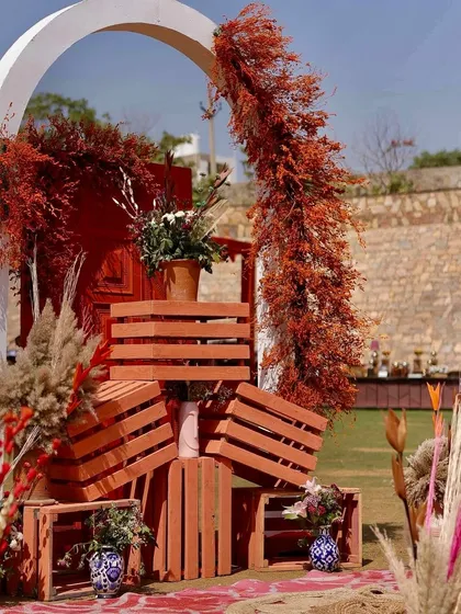 Another angle of the crate installation, showing the beautiful combination of painted wood, dried foliage, and ceramic vases.
