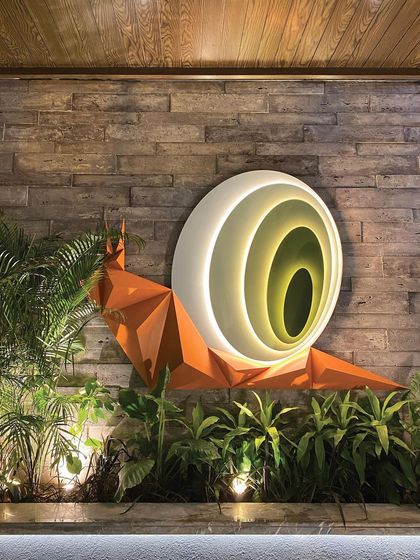 Our "Harmony in Motion" snail installation comes to life at night, with internal lighting creating a hypnotic, glowing effect that turns the sculpture into a focal beacon.