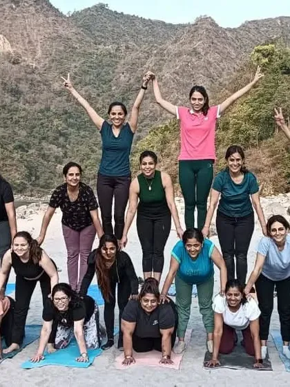 A human pyramid of strength and support. This acro yoga pose is a testament to the trust and teamwork within our group.