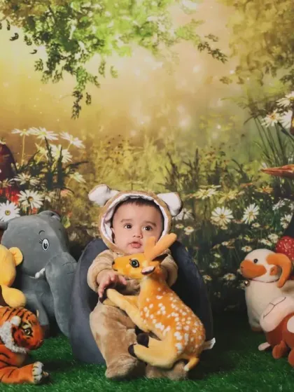 A sweet moment with a toy deer in our woodland creature setup.