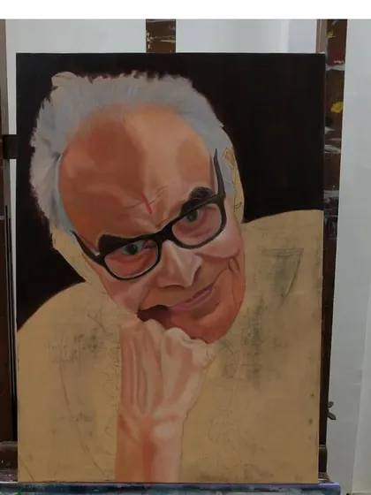 Here, I'm working on the hand and shirt, leaving the final details for the face. The process involves working across the entire canvas to ensure harmony.