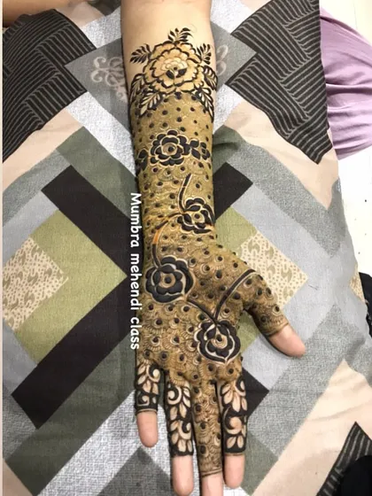 This full-arm design uses negative space and bold flowers to create a really modern and striking look.