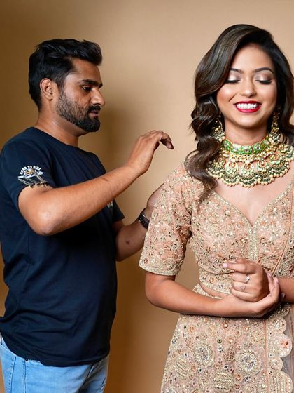 Our instructor demonstrates a hair curling technique on a model during a live demo. I believe in showing, not just telling, to ensure effective learning.