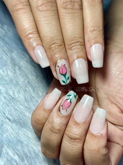 The square shape of the nails gives this soft, floral design a modern edge.