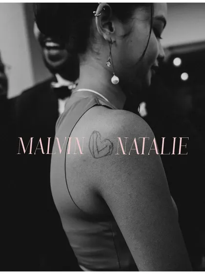 Details tell a story. The bride's tattoo, her gentle smile, and the groom's laughter in the background create a layered, intimate portrait. I use black and white to strip away distractions and focus purely on emotion and connection.