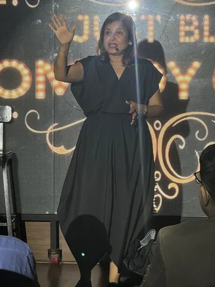 Performing a stand-up bit at the Just BLR Comedy Club. I mix personal stories with my ventriloquism act.