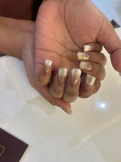 This client chose our square-shaped extensions with a beautiful gold and white cat eye effect.