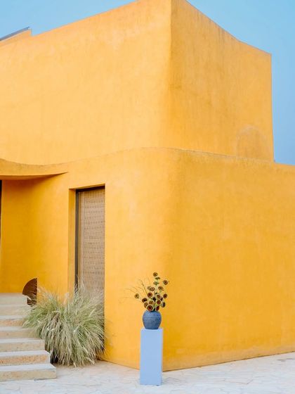 The same scene under a different light, showing how the building's character shifts from the golden warmth of the afternoon to the cool tones of dusk.