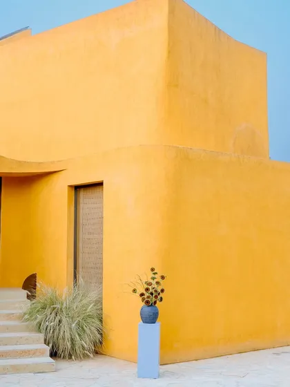 The same scene under a different light, showing how the building's character shifts from the golden warmth of the afternoon to the cool tones of dusk.