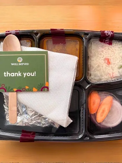 A little thank you note from me with every meal! This packed thali shows all the components you get: a main sabzi, dal, rice, roti wrapped in foil to stay warm, and a fresh salad.