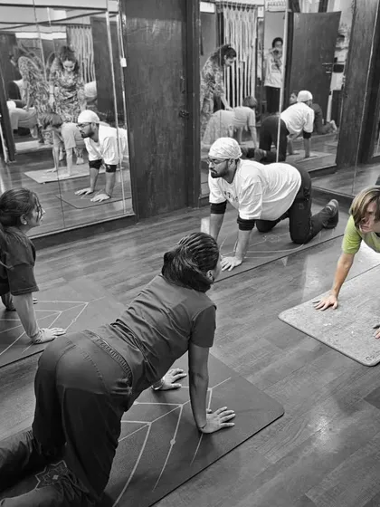 A Teacher Training class in progress, focusing on the foundational Cat-Cow stretch. We break down every asana to understand its physical and energetic benefits.