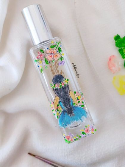 I painted a self-portrait on my own Jo Malone perfume bottle, showing myself holding a bunch of florals. It was a fun way to practice new techniques and personalize something for myself.