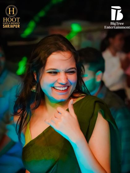 A beautiful, happy smile from someone in the crowd at Hoot Cafe.