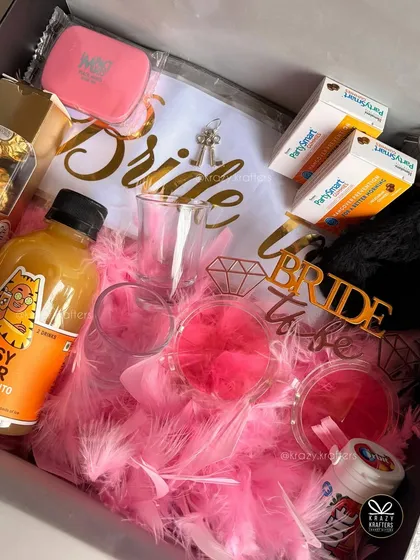 Let's get the party started for the bride-to-be! This fun-filled bachelorette hamper is packed with everything she needs for her celebration, including a 'Bride' sash, party props, and some bubbly to toast to her next chapter.