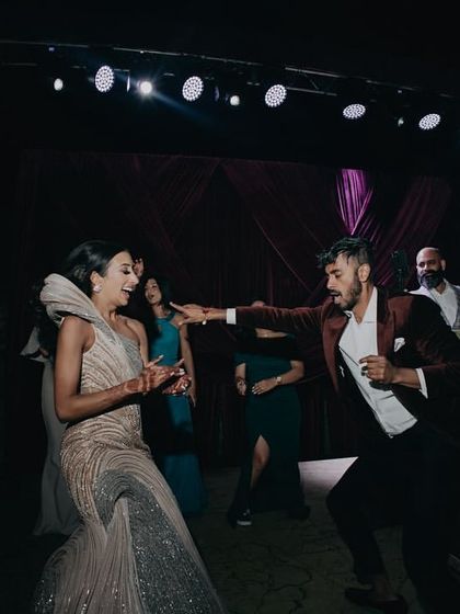 The happy couple sharing their first dance at the reception, kicking off a night of celebration.