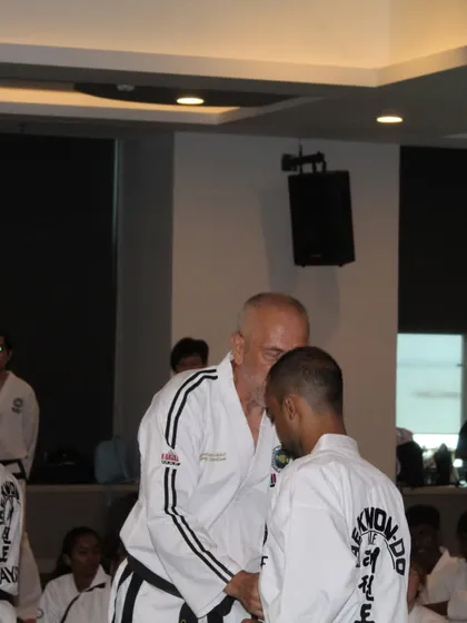 Receiving guidance from a Grand Master during an International Instructor Course (IIC). Direct feedback from the world's best is invaluable for growth.
